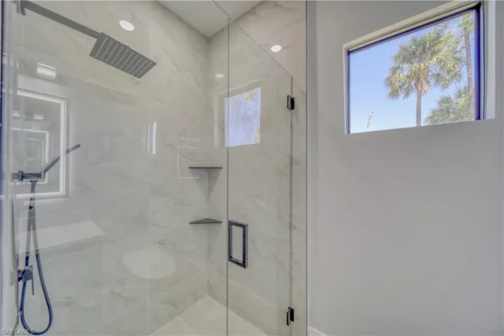 Bath #4 (Pool) with a shower stall