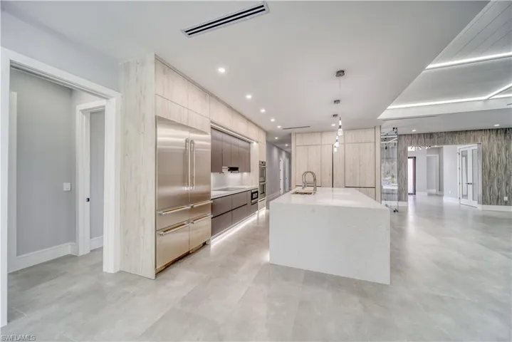 Kitchen featuring Thermador appliances, with stainless steel finishes, modern cabinets, and a huge sink