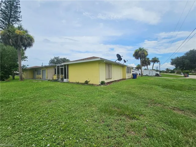 Expansive grass lawn surrounding the property