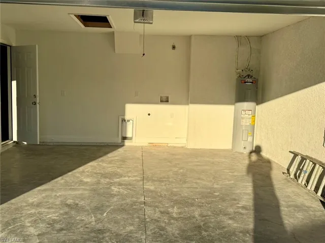 Garage featuring water heater