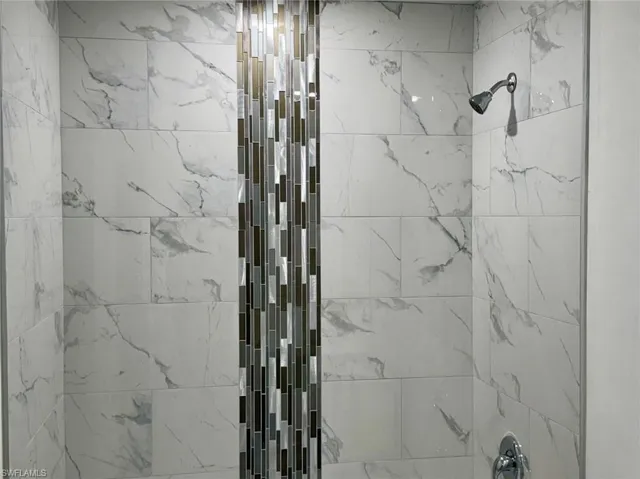 Bathroom with tiled shower