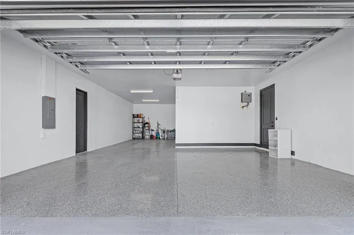 Garage featuring electric panel