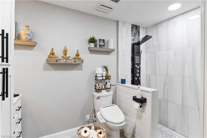 Like the rest of the home, this master bathroom is EXTRAORDINARY! True spa like five-star resort style with multiple refreshing showerheads, bidet and custom tile and millwork!