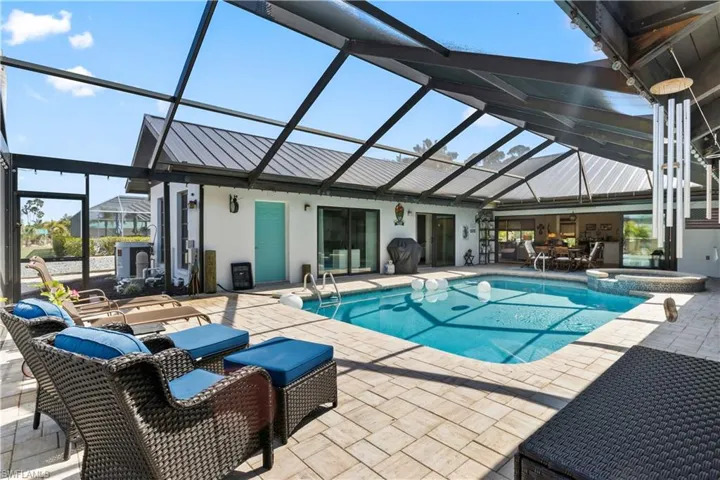 Owners widened and extended the outdoor patio and not only do you have a super-sized pool but multiple spaces, both shaded and open, to lounge around and enjoy our beautiful Florida weather!