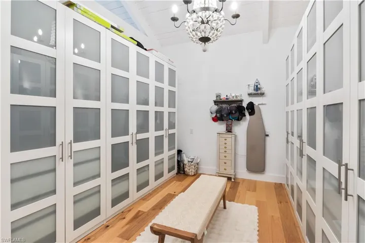 Master closet is 16 feet long with custom cabinet combinations and TONS of storage!
