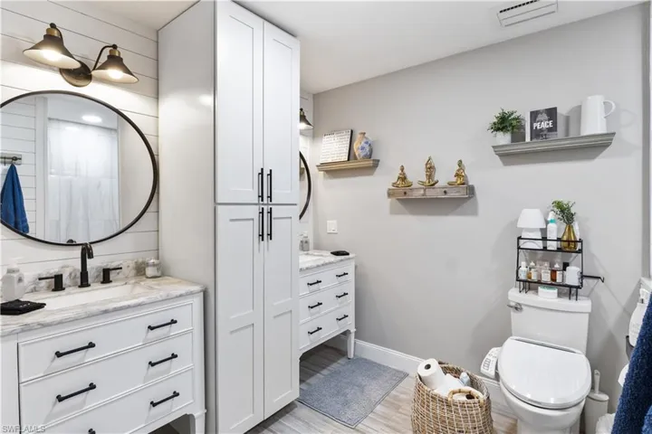 Master bathroom with dual vanities, wall to ceiling cabinet and artisan touches!