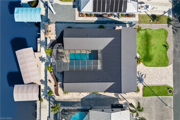 Looking down on this pristine beauty with an additional parking area across the street. Located in Manatee Bay, this is a voluntary Property Owners Association for $150 a year which gives you access to a private boat ramp on Manatee Drive! Streets were recently paved and there is pride of ownership throughout the community.