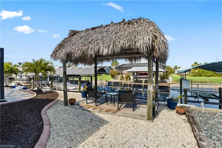 Tiki hut adds a nice touch of shade and ambience - a perfect place to wind down or just enjoy the view! Manatee canal is frequented by dolphins, manatees and other sealife - the fish are always jumping and the birds are always singing...simply a wonderful place to enjoy nature!