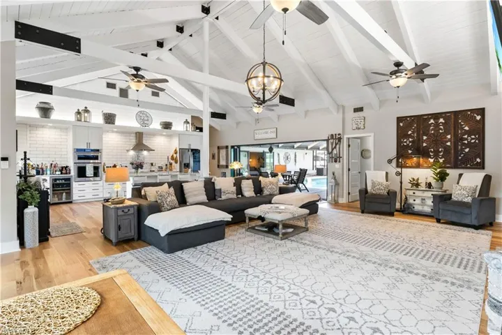 Supersized couch is dwarfed by the large open space - over a 1,000 feet in combined living/dining and kitchen area!