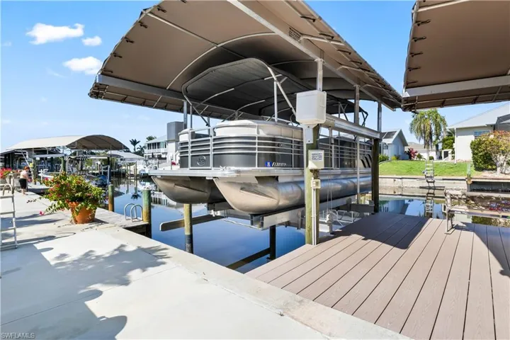 Why settle for one canopied boatlift when you can have two? Extensive outdoor area for all boating enthusiasts! Both lifts are 10,000 pounds and there is still additional parking for jet skis or smaller boats!