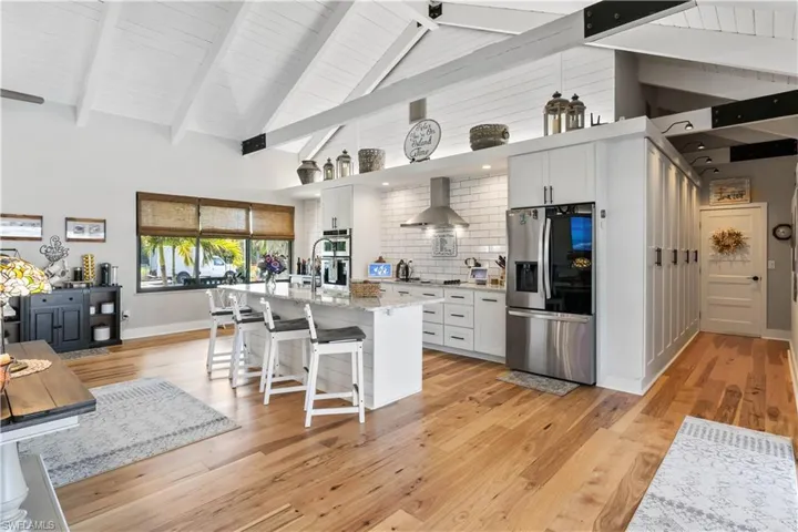 Subway tile, neutral grout, complimentary bevilled granite counters, extensive cabinetry and kitchen counter space are perfect if you are a gourmet chef OR practicing gourmet chef:-)