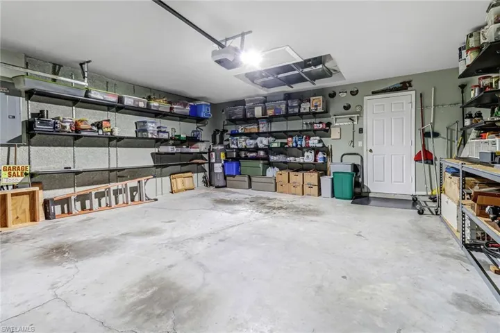 Garage featuring a garage door opener