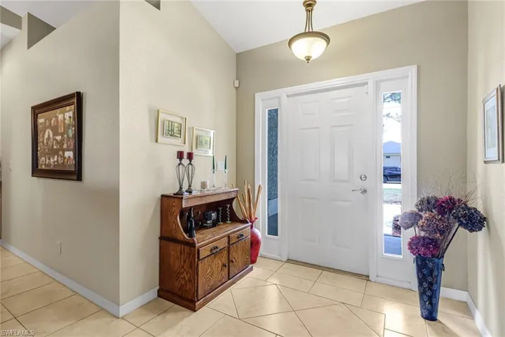 Foyer featuring light tile patterned flooring