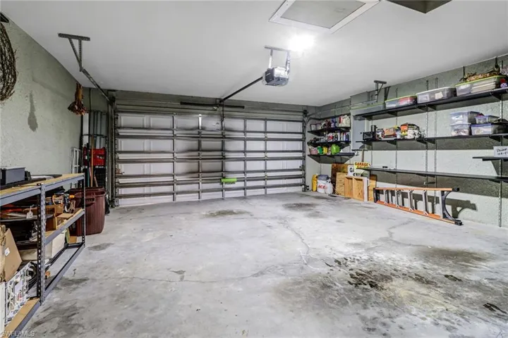 Garage featuring a garage door opener