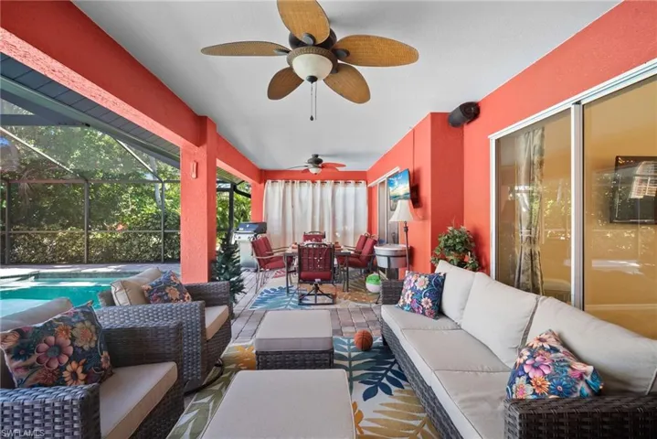 Sunroom / solarium featuring outdoor dining area, a patio area, outdoor lounge area, and a ceiling fan