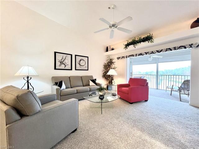 Living room w/ vaulted ceiling