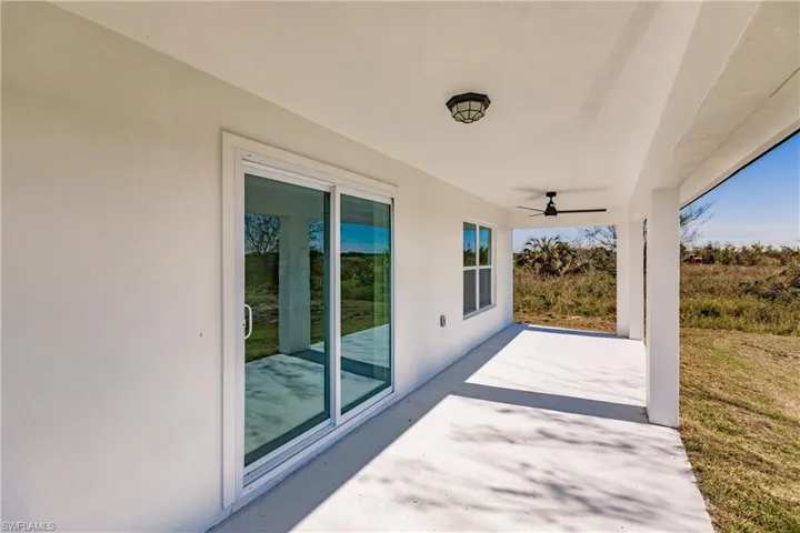 View of patio with ceiling fan