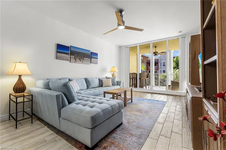 Living room with high ceilings and sliders to lanai