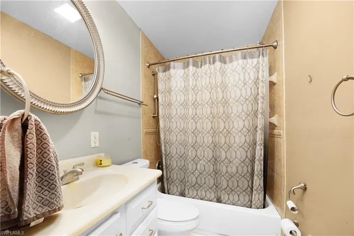 Bathroom featuring vanity and shower / bath combo