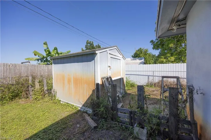 View of shed featuring a fenced backyard