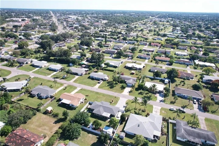 Aerial overview of property's location featuring nearby suburban area