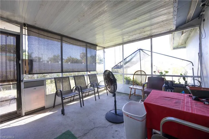 Sunroom / solarium with expansive windows