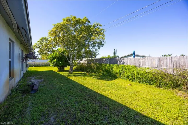 View of fenced backyard