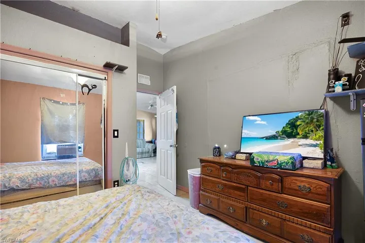 Bedroom featuring a closet and light tile patterned flooring