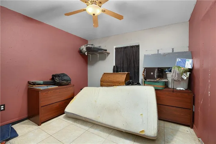 Bedroom featuring a ceiling fan and light tile patterned floors