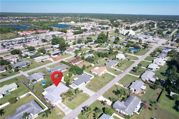 View of property location with nearby suburban area