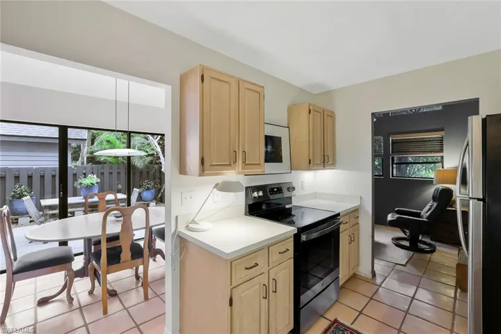 Opens to dining and family rooms