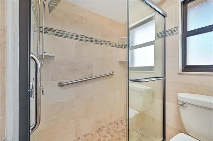 Full bath with a shower stall