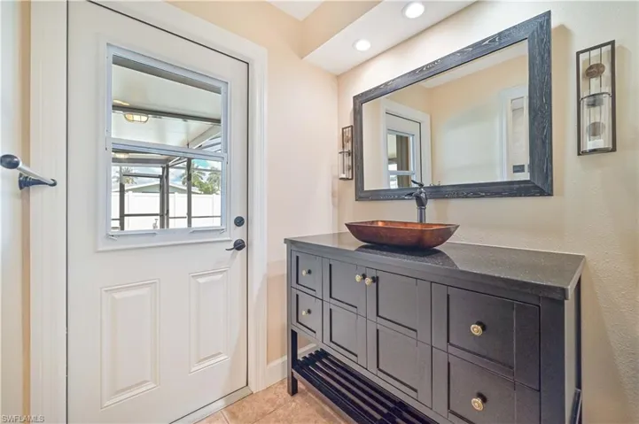 Entryway with recessed lighting and tile patterned floors