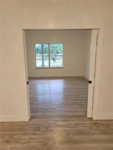 Empty room featuring light wood-style flooring