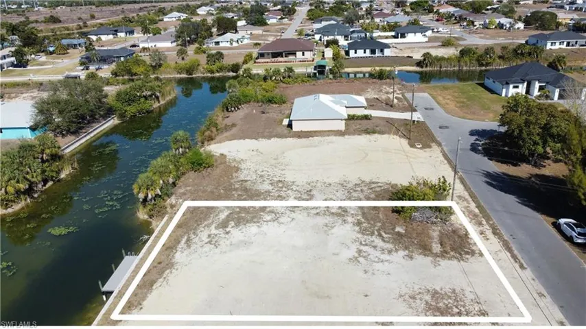 Aerial view of residential area with a large body of water