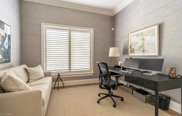 Office featuring ornamental molding and light wood-style floors