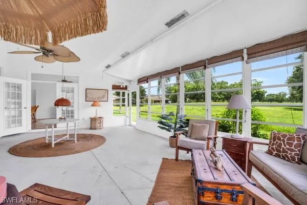 Sunroom featuring ceiling fan and a healthy amount of sunlight