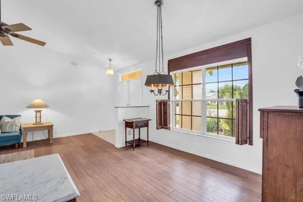 Dining room featuring wood-type flooring and ceiling fan
