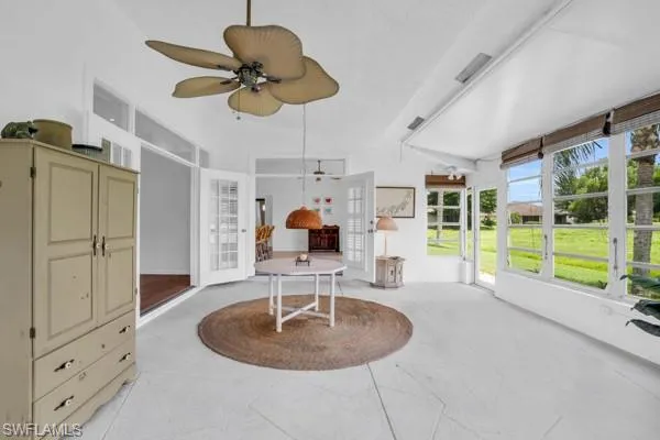 Sunroom featuring ceiling fan