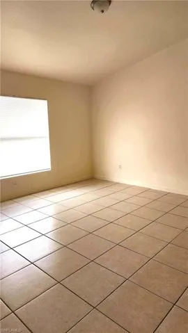 Primary room featuring light tile patterned floors