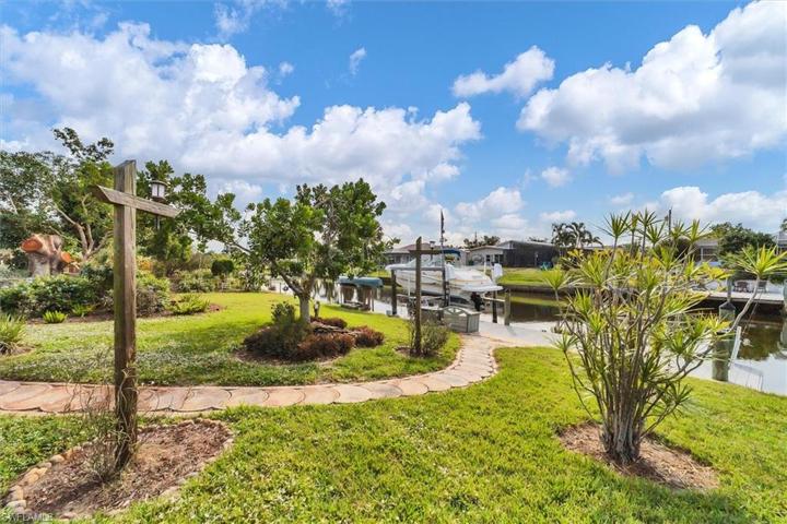 Backyard, canal, dock and lift