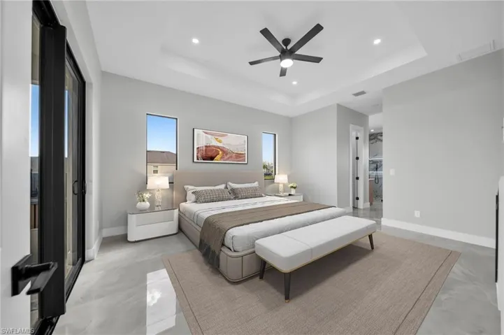 Bedroom with recessed lighting, a ceiling fan, and a tray ceiling