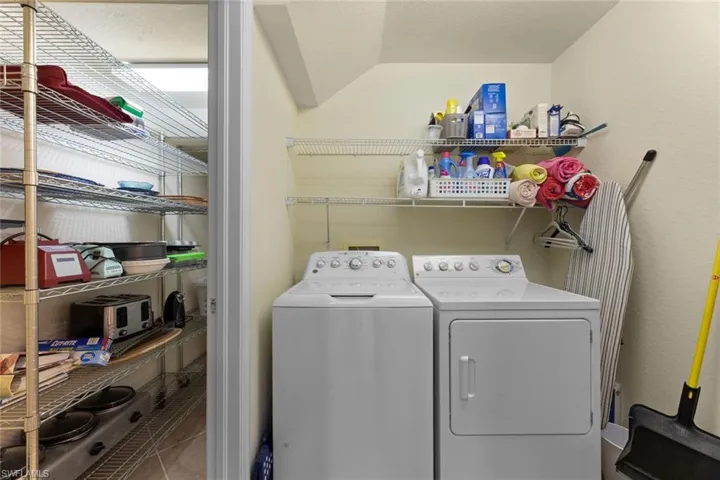 Laundry room w/under stairway storage