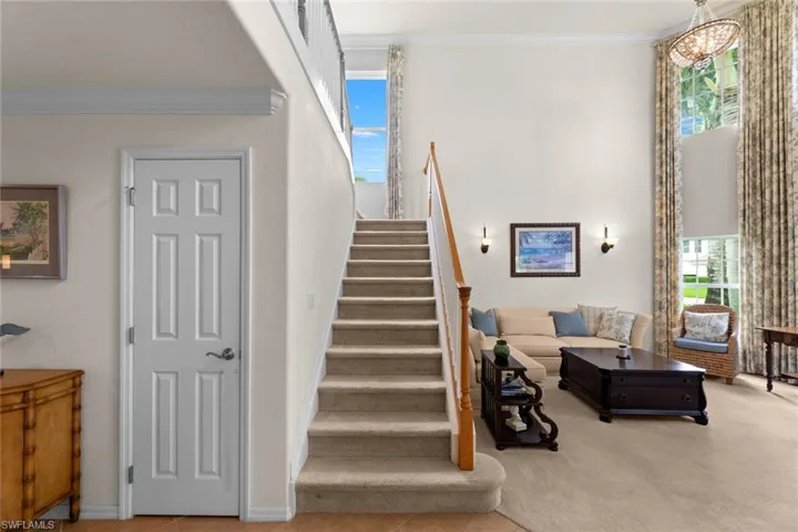Coat closet to left of staircase