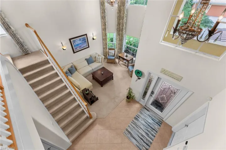 View of foyer and living room from loft