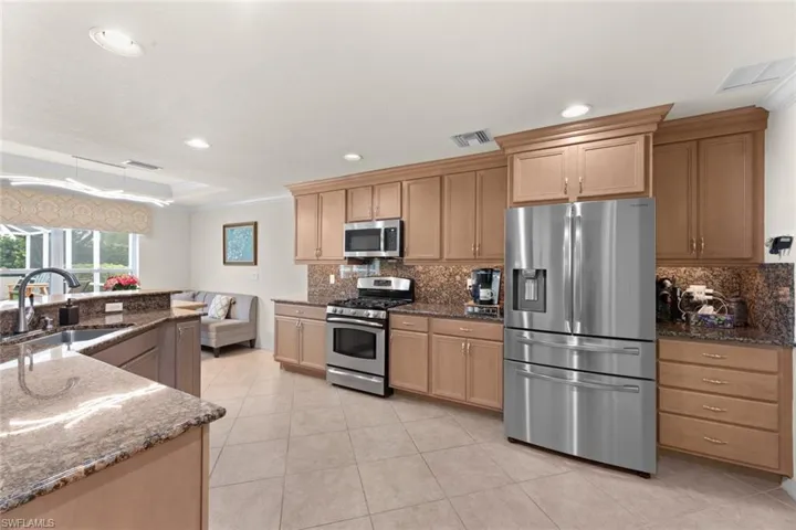 Kitchen w/ample cabinetry and counter tops