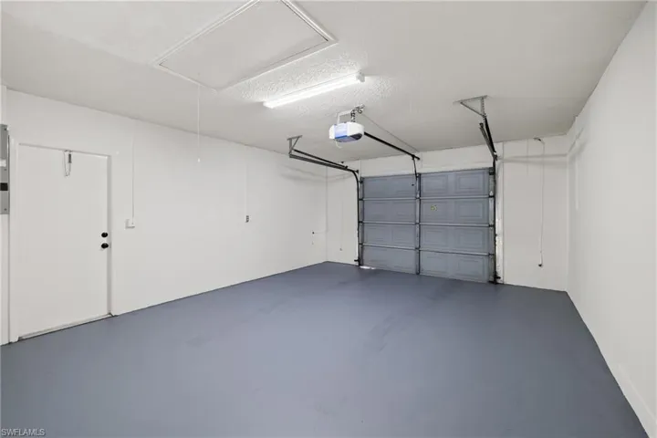 Garage featuring a garage door opener
