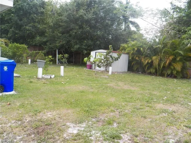 View of yard with a storage shed