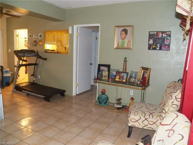 Living area with light tile patterned floors
