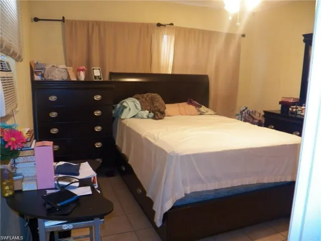 Bedroom with tile patterned floors
